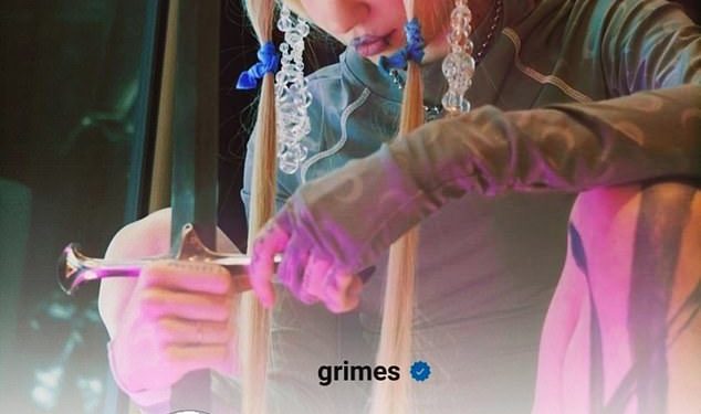 grimes-celebrates-2-million-instagram-followers-by-sharing-a-behind-the-scenes-snap-from-alter-…
