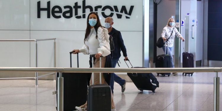 boeing,-airline-stocks-tumble-as-new-covid-variant-spurs-travel-curbs-–-cnbc
