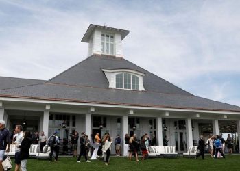 file-photo:-guests-are-seen-outside-the-clubhouse-following-the-opening-ceremony-at-…