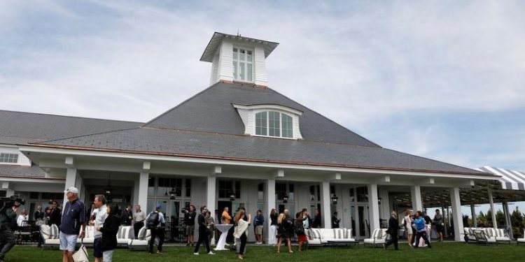 file-photo:-guests-are-seen-outside-the-clubhouse-following-the-opening-ceremony-at-…