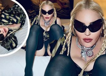 madonna-puts-on-a-smoldering-and-leggy-display-as-she-stretches-out-on-a-bed-in-new-…