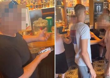 moment-pubgoer-is-caught-looking-at-snapchat-photo-of-woman's-bum-at-bar-before-being-…