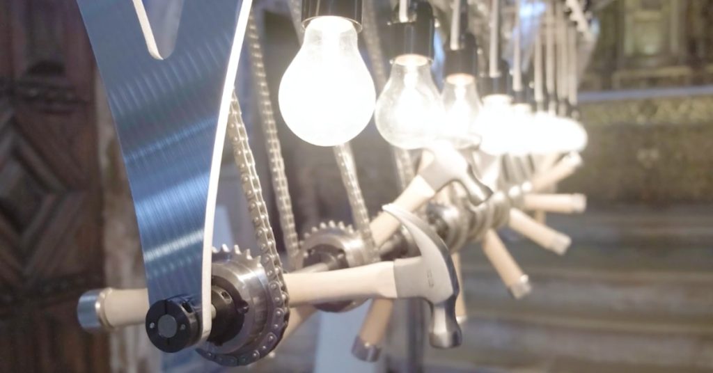 a-kinetic-sculpture-with-light-bulbs-and-hammers-in-motion-–-twistedsifter