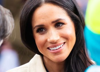 meghan-markle-rocks-chic-sleeveless-turtleneck-top-and-matching-skirt-in-first-major-…