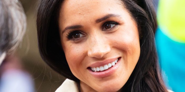 meghan-markle-rocks-chic-sleeveless-turtleneck-top-and-matching-skirt-in-first-major-…